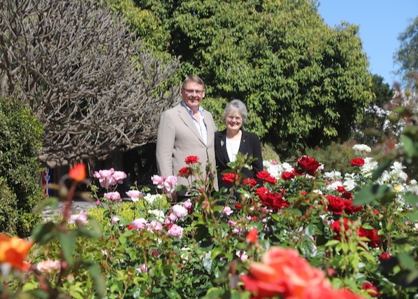 /Mr Bunten and Her Excellency in the rose garden